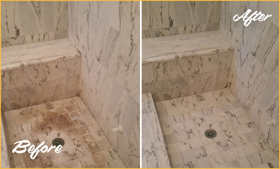 Before and After Picture of a Dirty Belville Marble Shower Cleaned to Eliminate Dark Stains